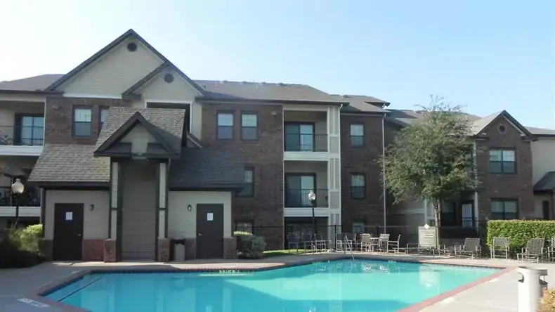 Multifamily community exterior beside a shared outdoor amenity